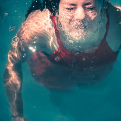 High angle view of woman in swimming pool