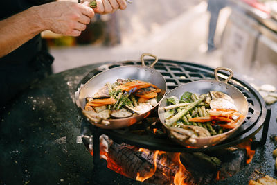 Cropped image of person preparing food