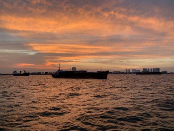 Scenic view of jakarta sea against sky during sunset