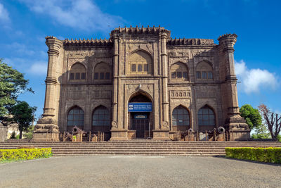 Facade of historic building against blue sky