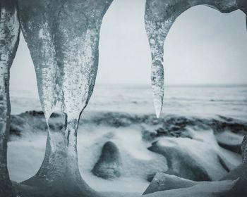 Close-up of frozen sea against sky