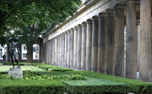 Woman standing in front of built structure