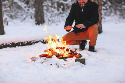 Person with fire on snow
