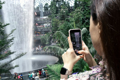 Man photographing through mobile phone