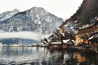 Panoramic view of lake and buildings against sky