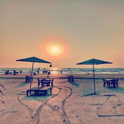 Scenic view of beach against sky during sunset