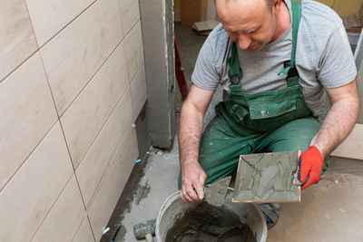 Side view of man working in workshop