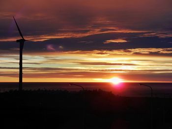 Silhouette of landscape against dramatic sky