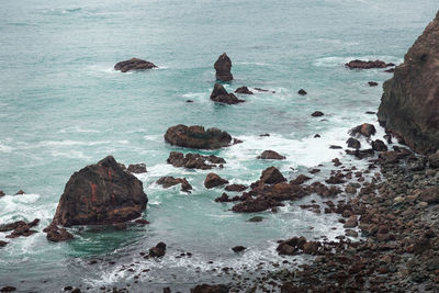 High angle view of rocks in sea