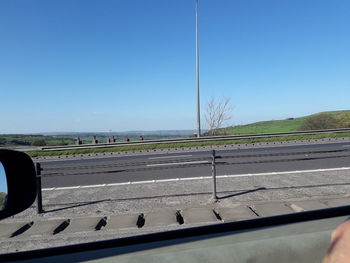 Road seen through car windshield