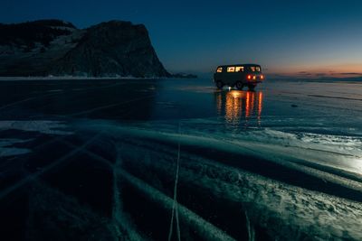 Scenic view of sea against sky during winter