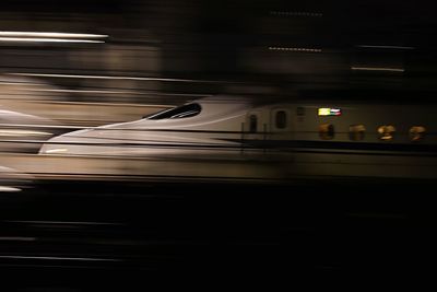 Blurred motion of train at railroad station