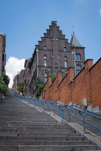 Low angle view of montagne de bueren in liège against sky