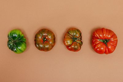 Directly above shot of tomatoes on pink background