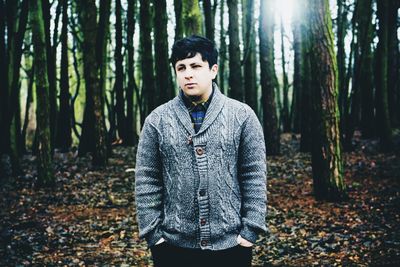 Portrait of young man in forest