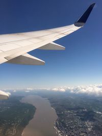 Airplane wing over landscape