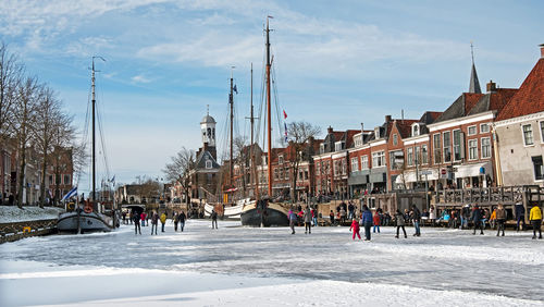 Winter fun on the canals in the city dokkum in the netherlands person