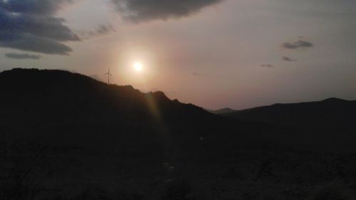 Silhouette mountains against sky during sunset