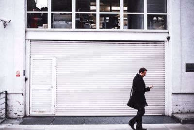 Man standing in front of building