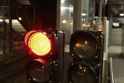Close-up of illuminated lighting equipment on street
