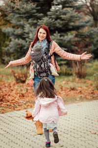 Portrait of a smiling girl standing outdoors