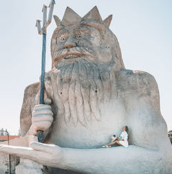 Low angle view of statue against sky