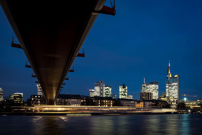 Illuminated city at waterfront