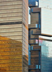 Low angle view of modern glass building in city