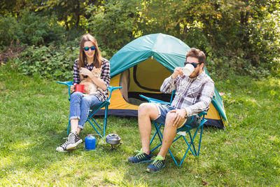 Men sitting in tent