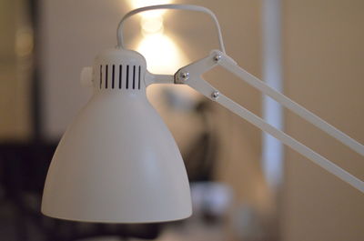 Close-up of illuminated lamp at home