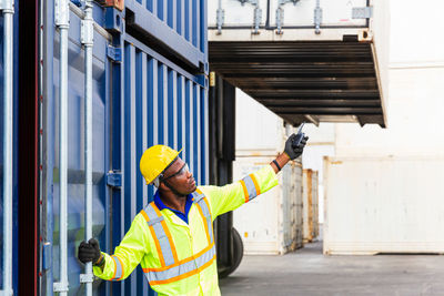 Mid adult man working at dock