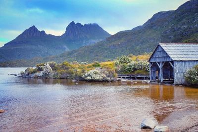 Scenic view of lake and mountains against sky