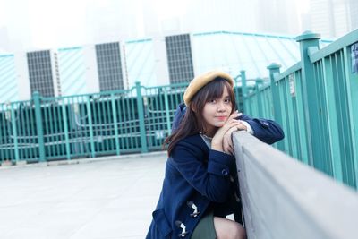 Portrait of young woman looking away