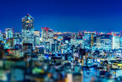 Illuminated buildings in city at night