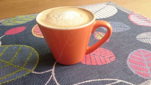 Close-up of coffee cup on table