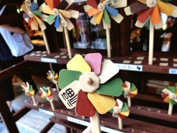 Close-up of various decorations hanging in store for sale