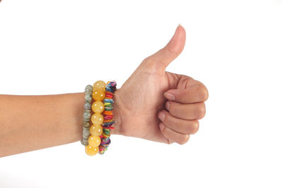 Close-up of human hand against white background