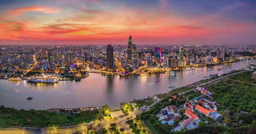 High angle view of buildings against cloudy sky during sunset