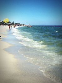 Scenic view of beach against clear sky
