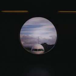 Close-up of airplane against sky