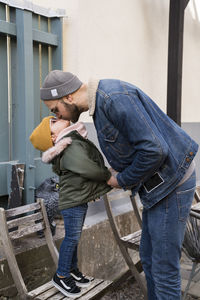 Girl giving father kiss