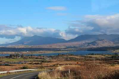 Scenic view of landscape and mountains against sky