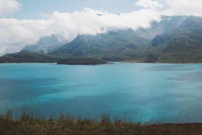 Scenic view of lake and mountains against sky