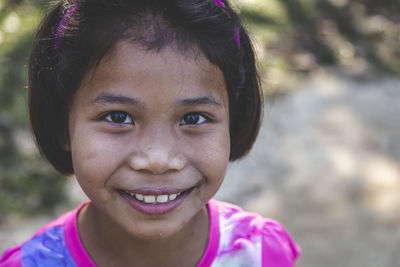 Close-up portrait of smiling girl