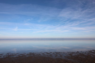 Scenic view of sea against blue sky