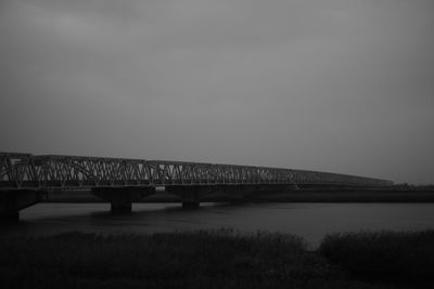 Bridge over river against sky