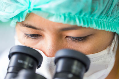 Close-up of woman working in laboratory