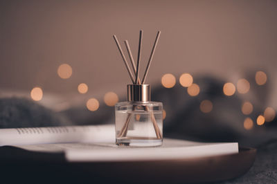 Close-up of light bulb on table