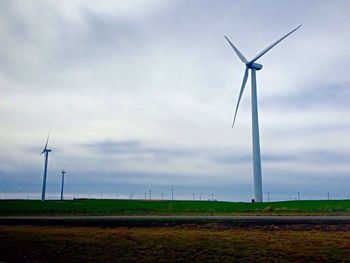 Wind turbines in field