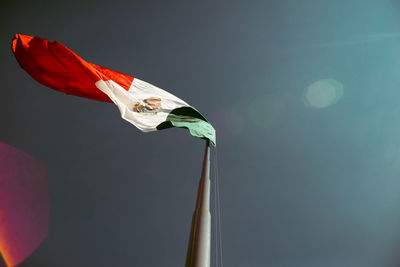 Low angle view of mexican flag against sky